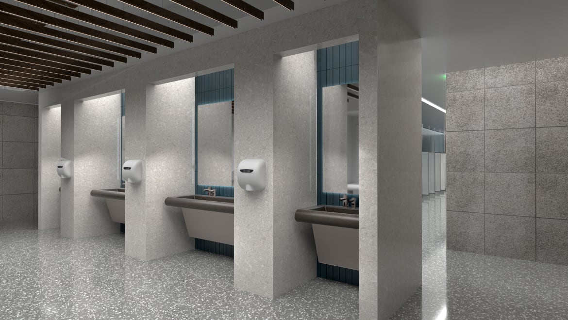 Angle view of restroom in an airport, sensor faucets and hand dryers in view